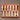 Set of wooden-handled chisels in a red box on a white background