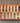 Set of wooden-handled chisels in a red box on a white background